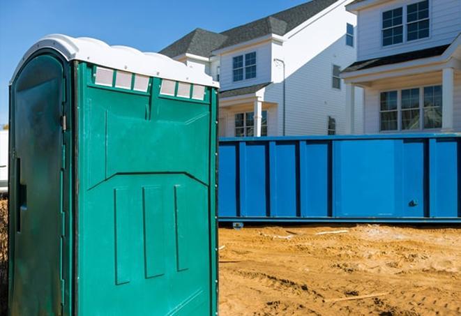 a sea of portable toilets at a work site